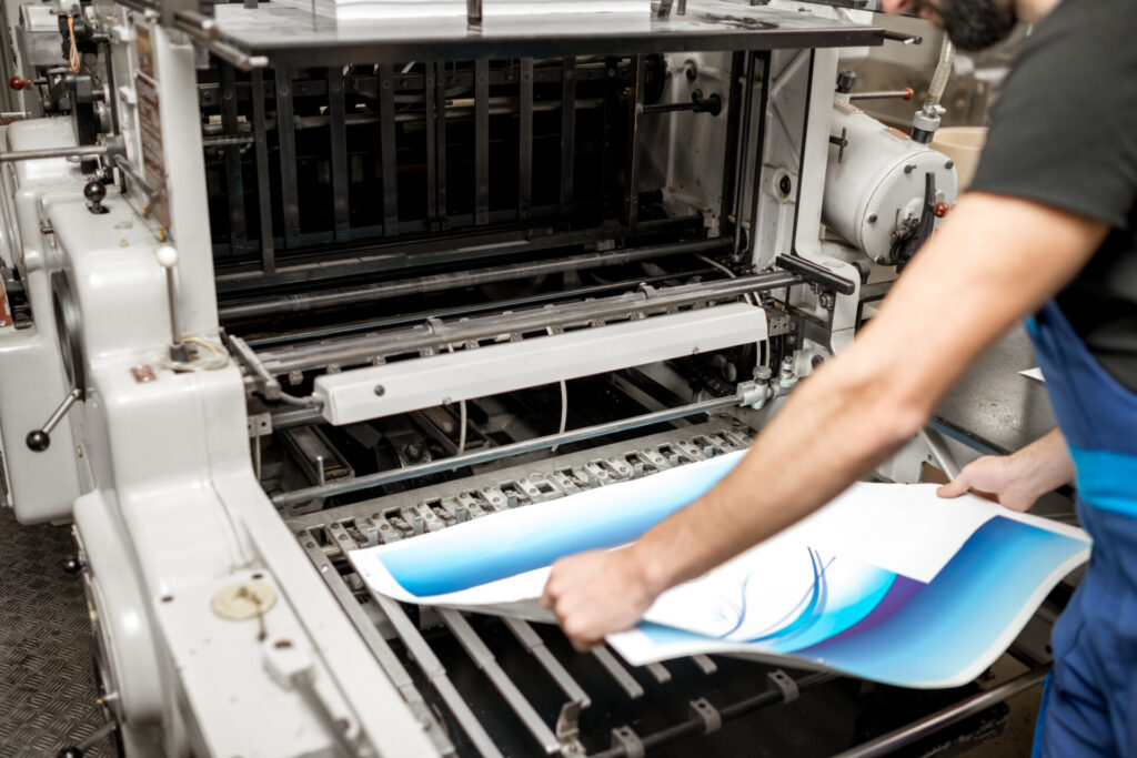 Checking printing quality at the printing plant This image has an empty alt attribute; its file name is printing-stickers-1024x683.jpg